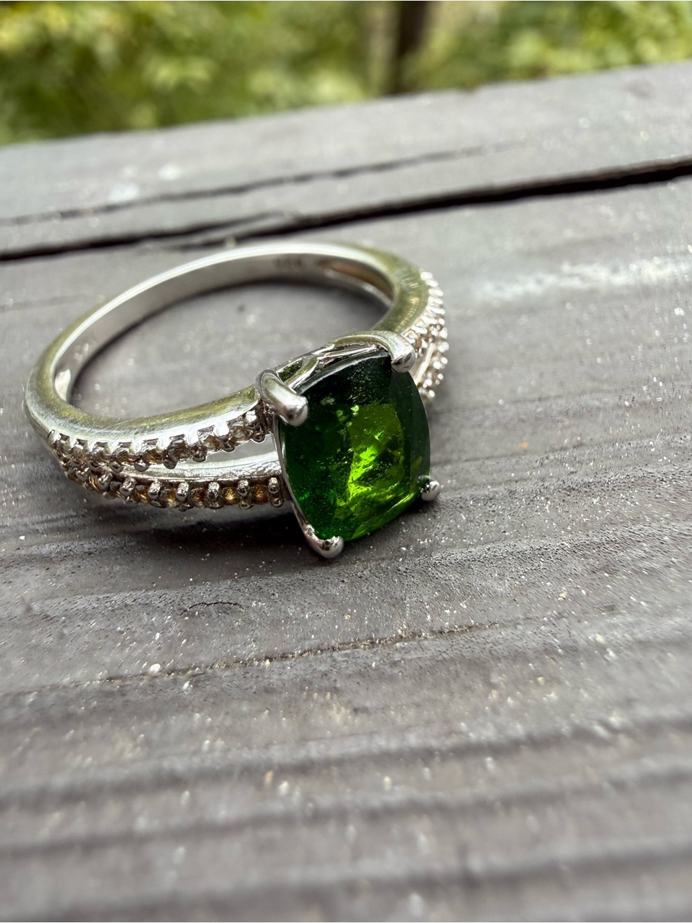 Emerald Green Cushion-Cut Solitaire Ring with Pavé Band